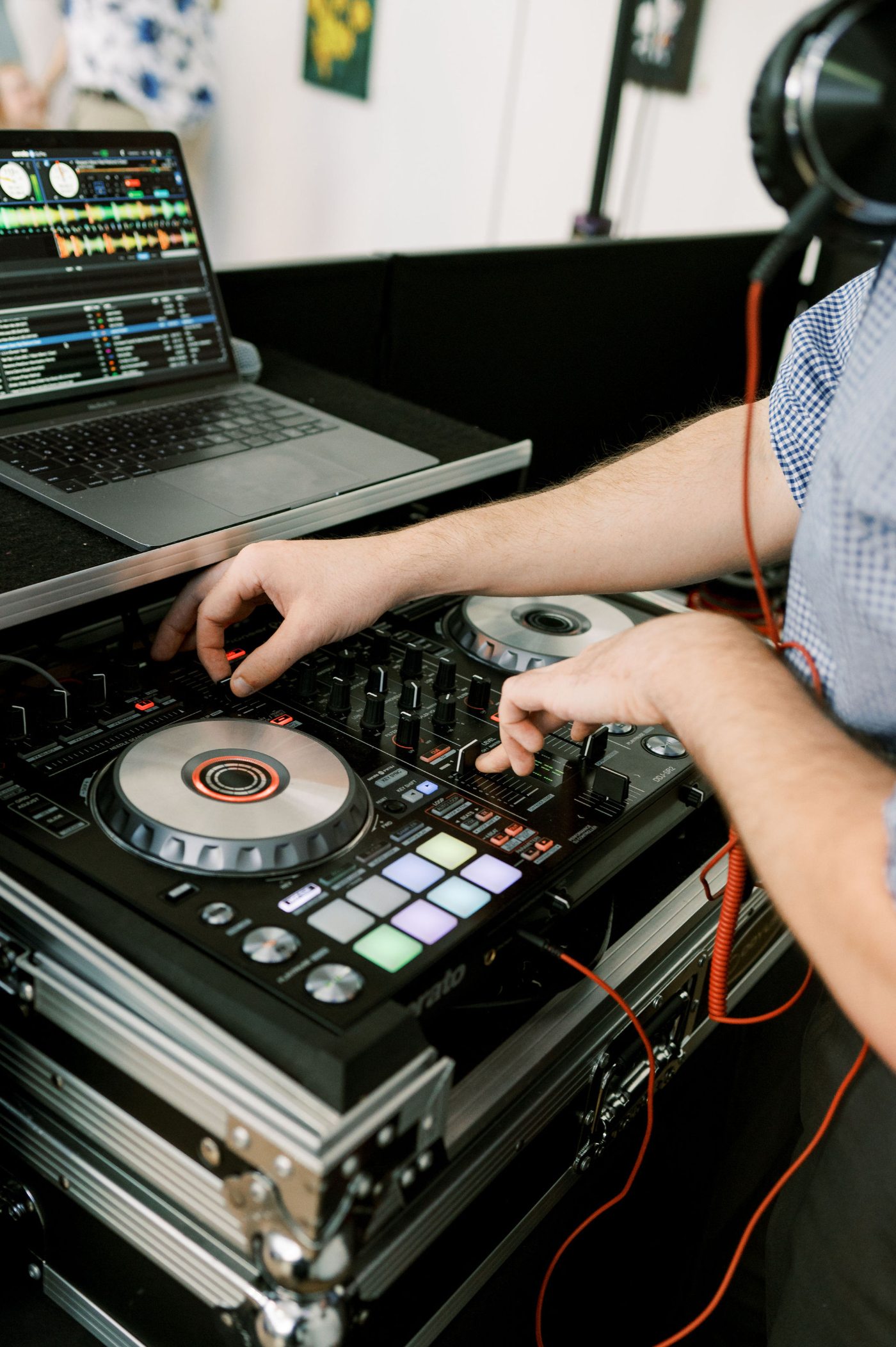 Nightbird DJ's hands on the controller mid-mix at an Athens, Georgia reception