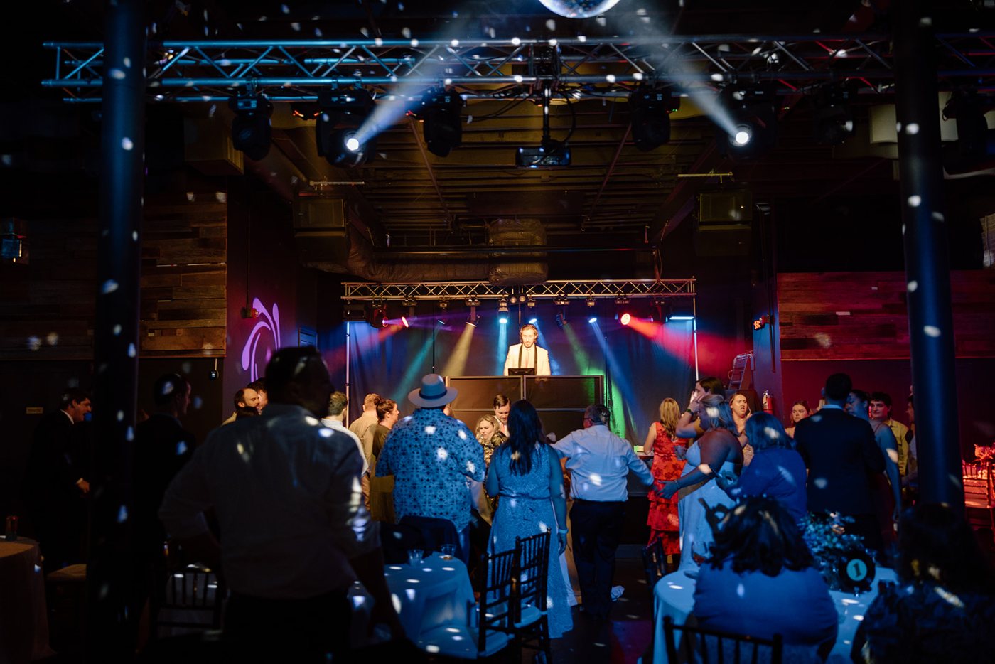 A full Nightbird production rig with moving-head lighting over a packed corporate event floor in north Georgia, photo by J DeNardo Photography