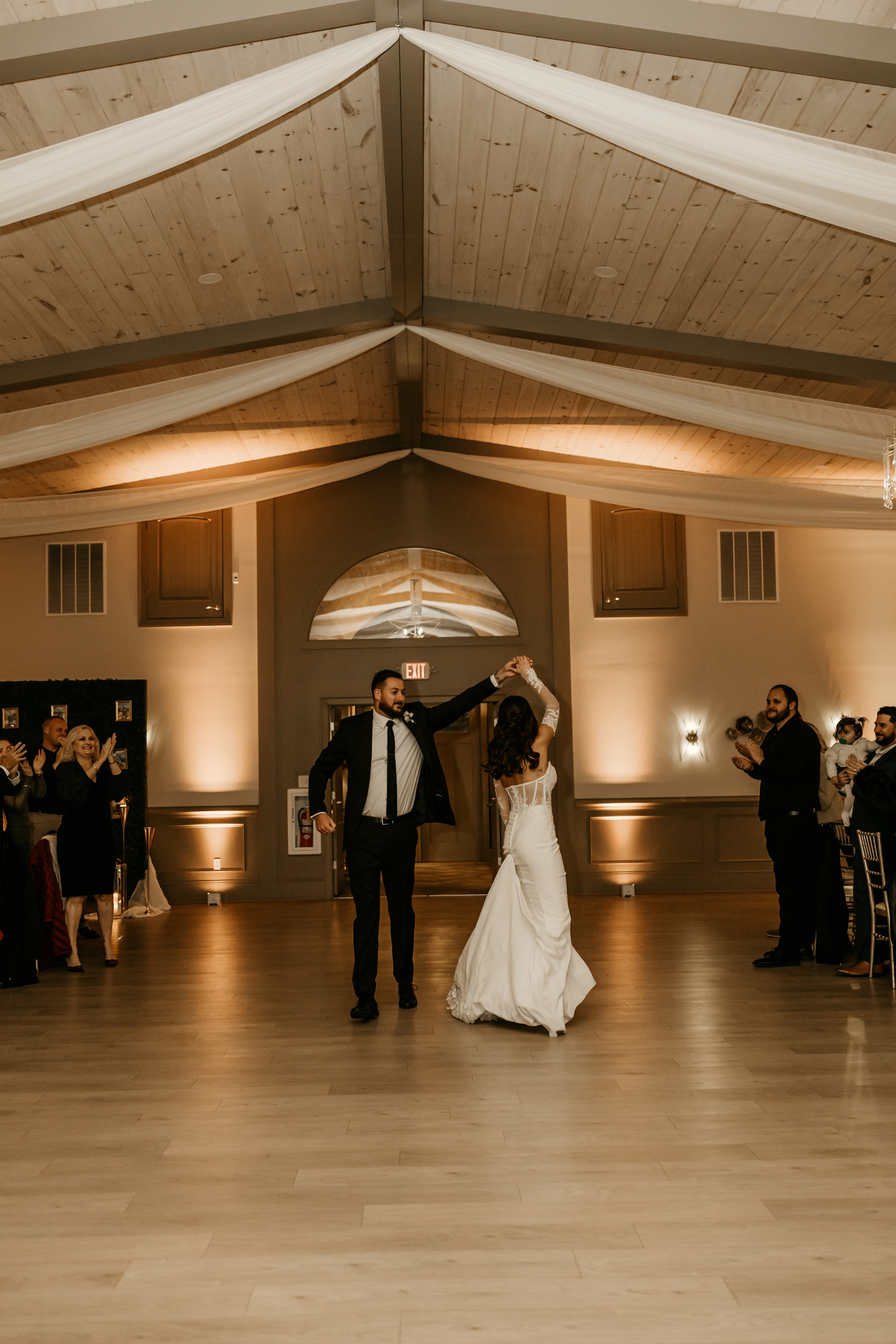 First dance in a room washed in warm amber uplighting, north Georgia wedding