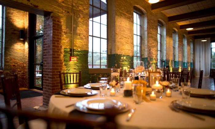 A north Georgia event room washed in warm uplighting